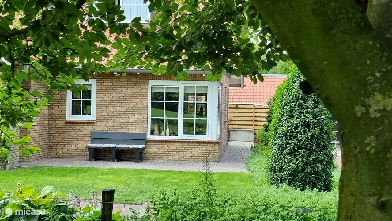 Front of house with spacious garden and view of the meadows