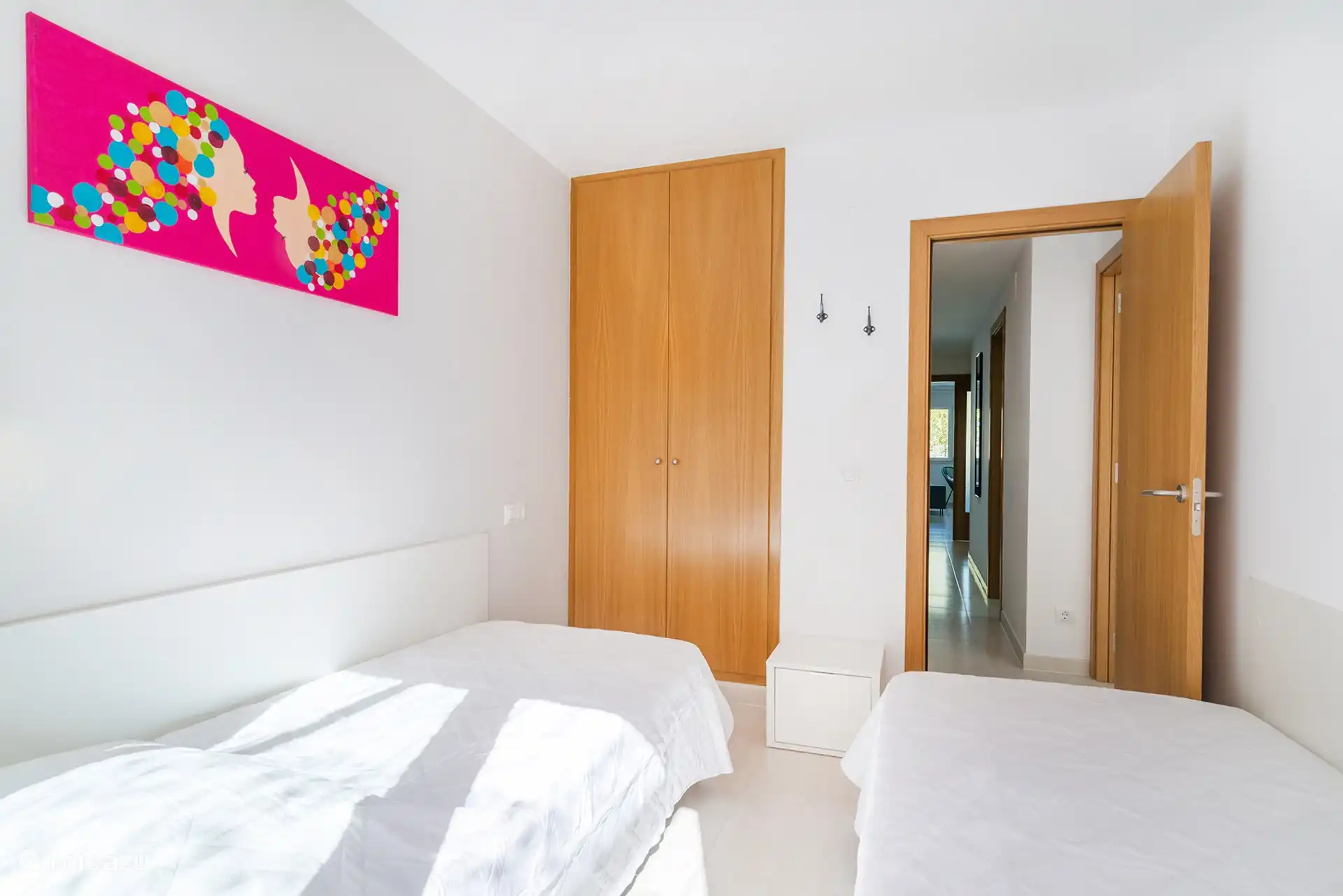 Bedroom with 2 x 1 bed with sliding doors to the spacious terrace.
