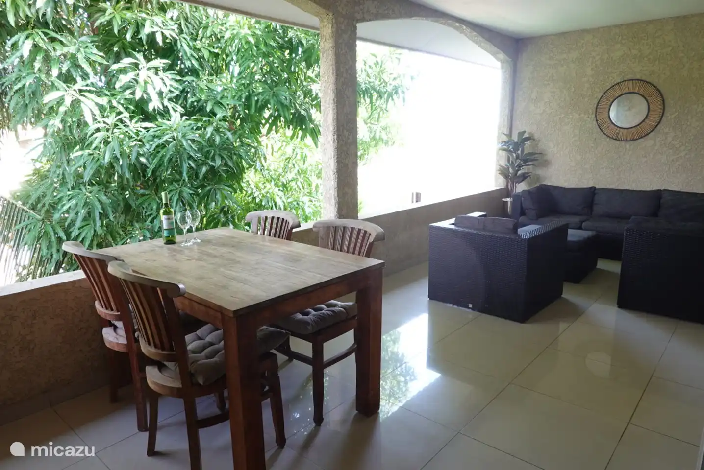 The porch with lounge set and dining table