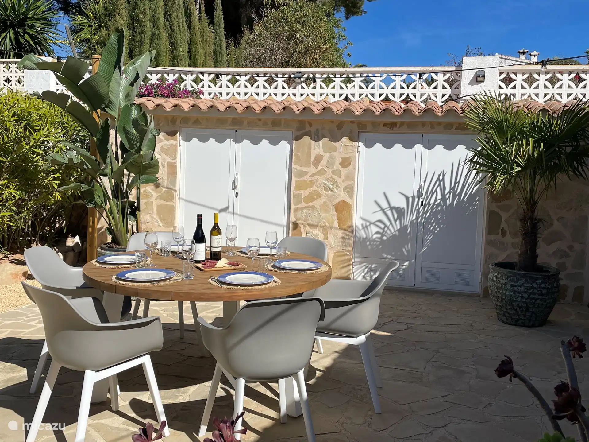 Backyard terrace with BBQ and lovely garden furniture
