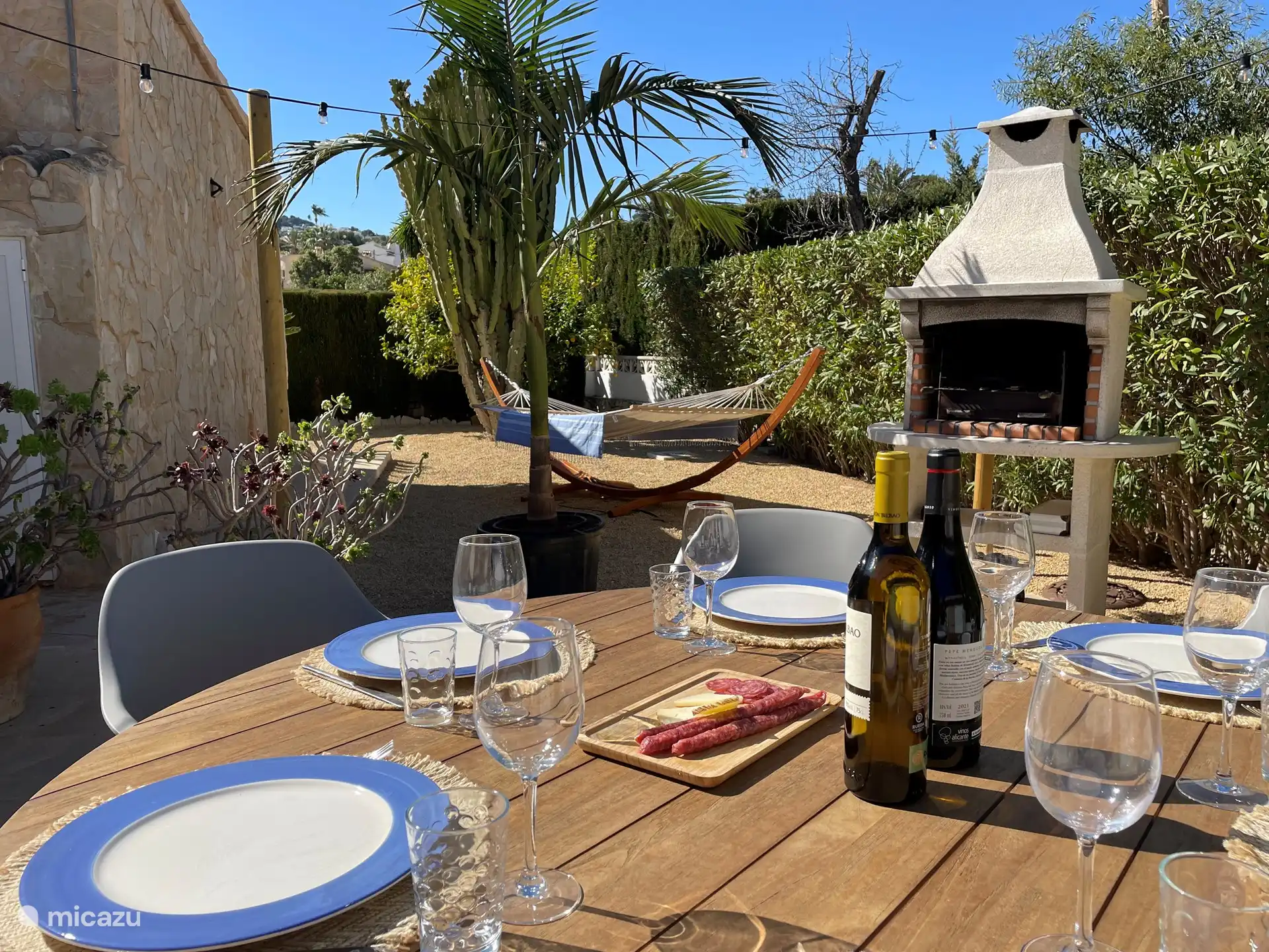 Backyard terrace with BBQ and lovely garden furniture