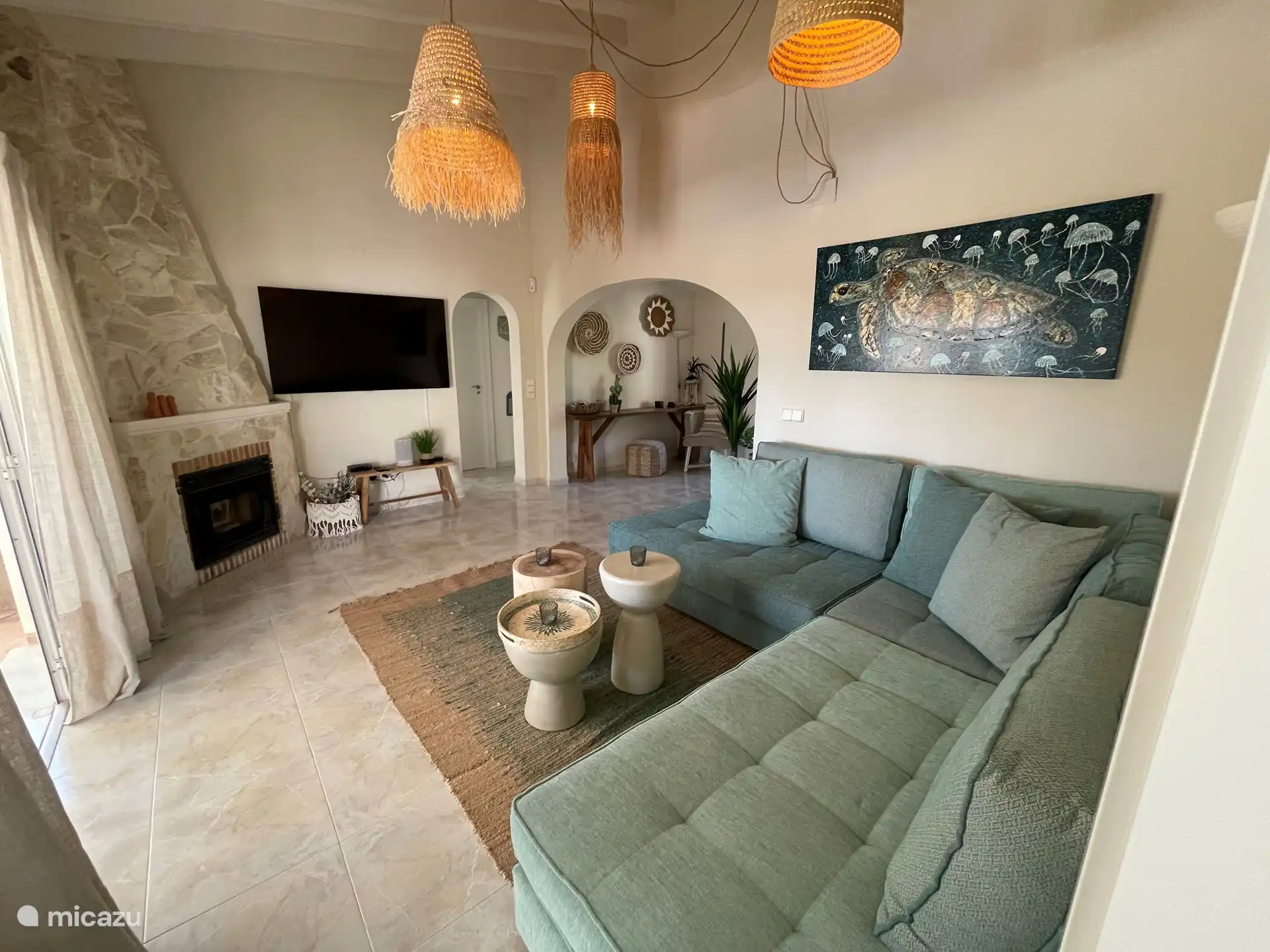 Living room with relaxing corner sofa and television