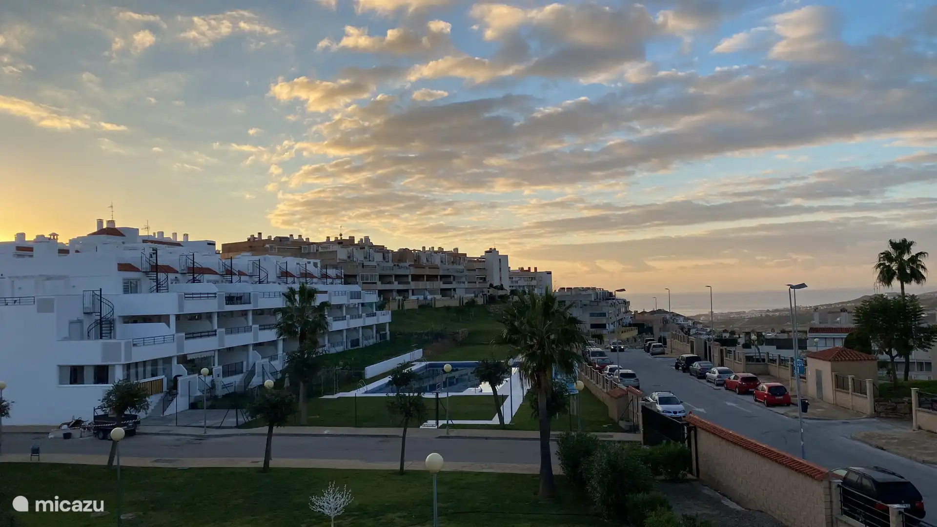The view from the balcony over the street and the sea