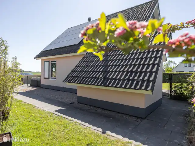 Maison de vacances de luxe avec spa et sauna | Pays-Bas, Frise, Tzummarum - maison de vacances Notre maison de vacances vue de côté.