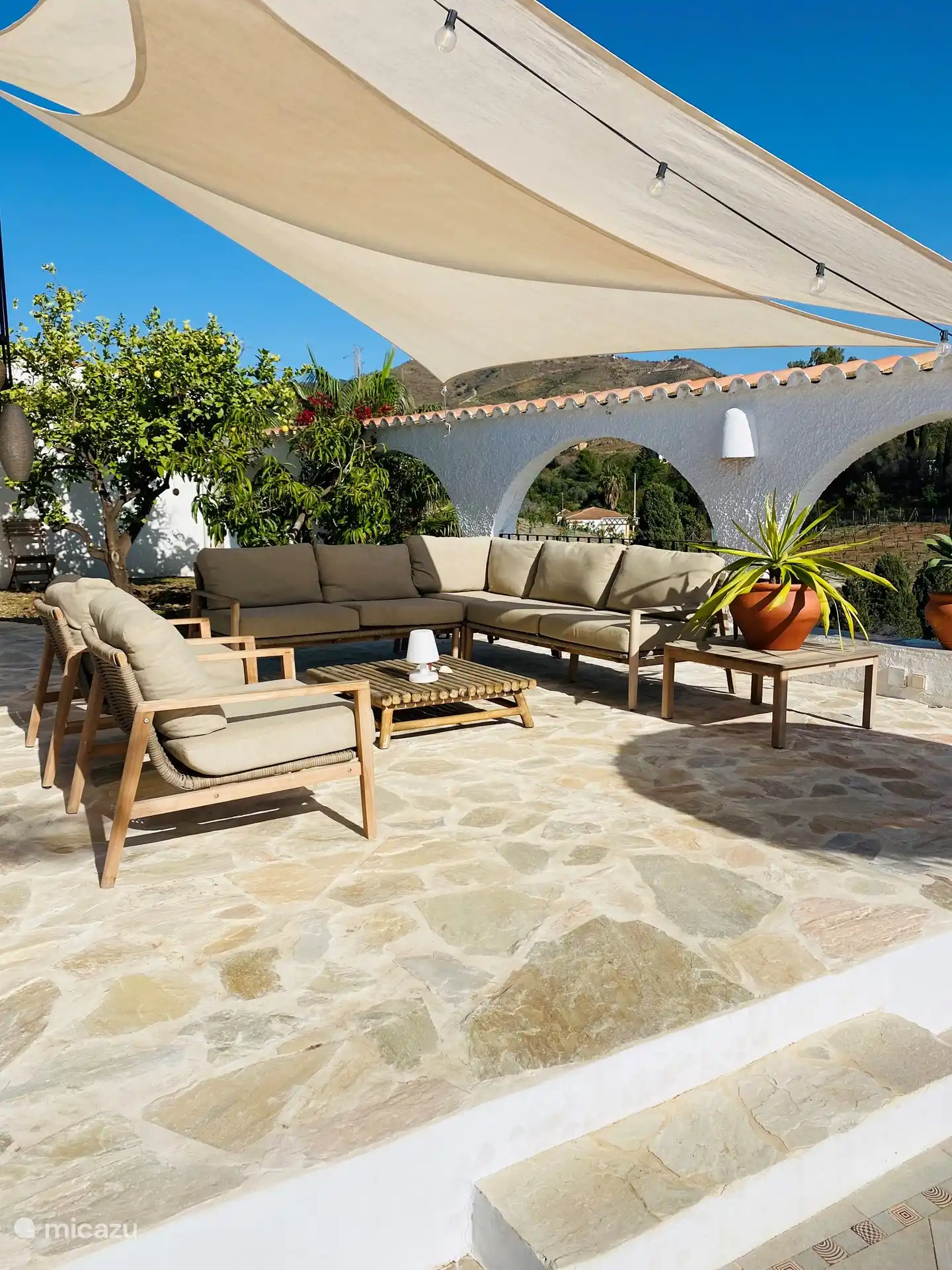 Lovely terrace next to the house under the shade cloths overlooking the pool and sea