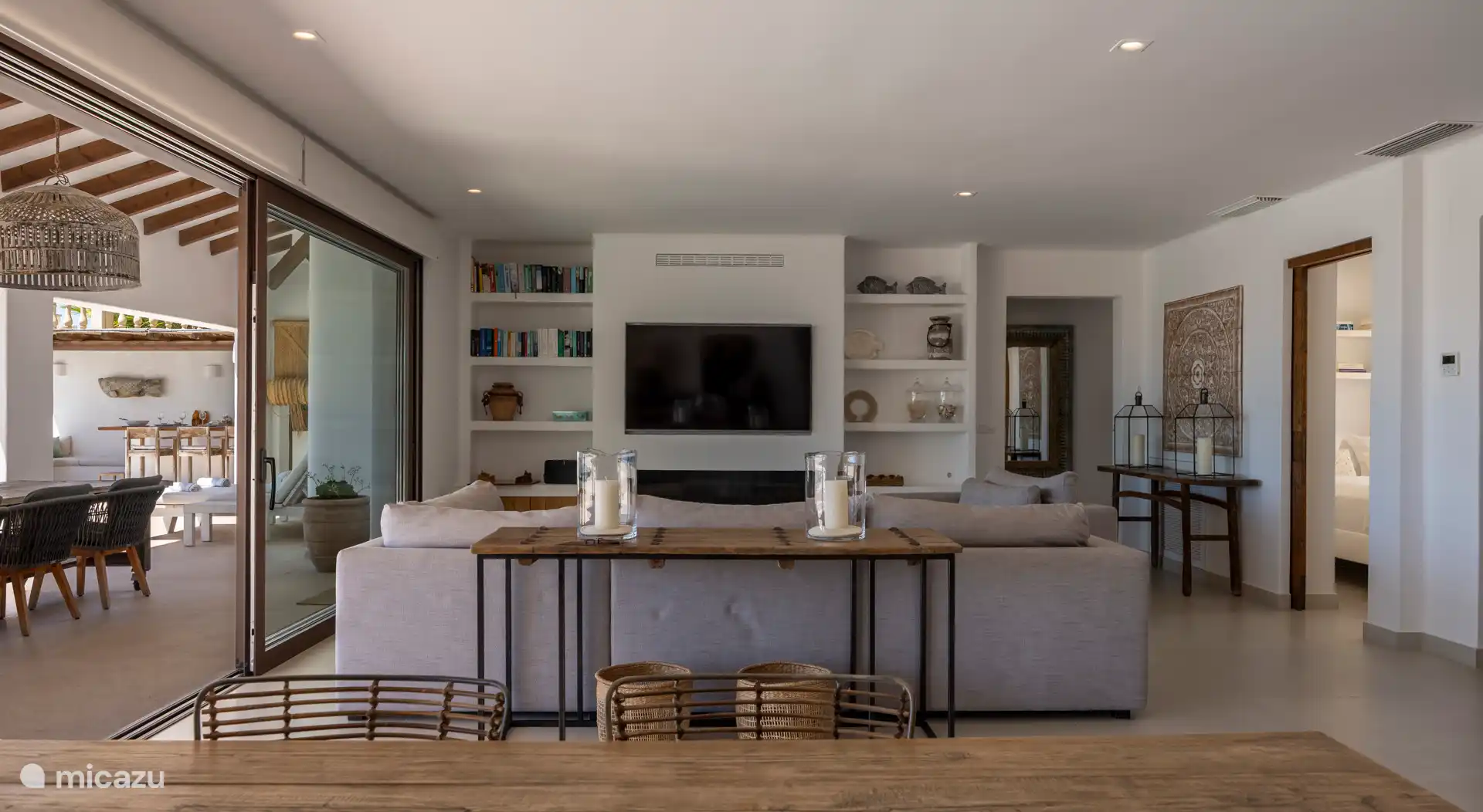 The sitting area with a gas fireplace under the TV.