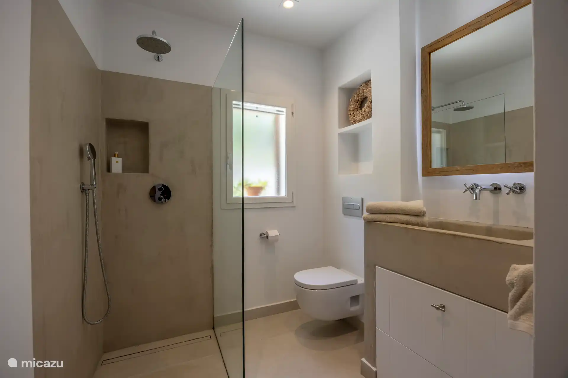 Sink and walk-in shower belonging to the second bedroom
