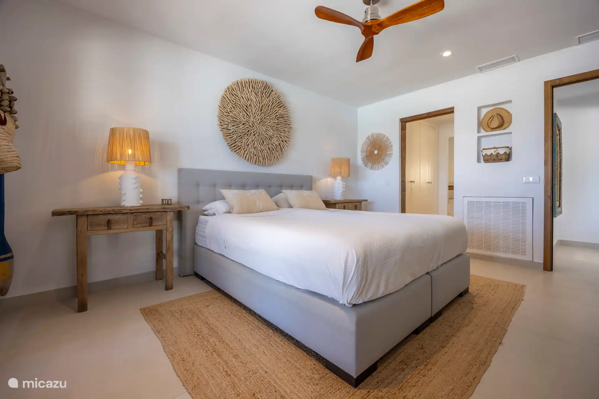 The master bedroom with adjoining wardrobes and the bathroom, the bed is 180 x 220.