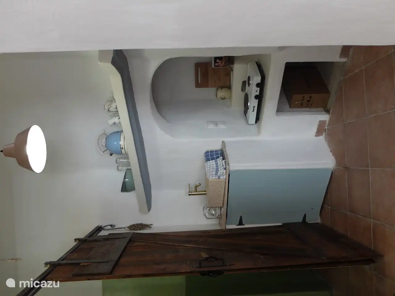 Traditional kitchen with large fridge-freezer combination.