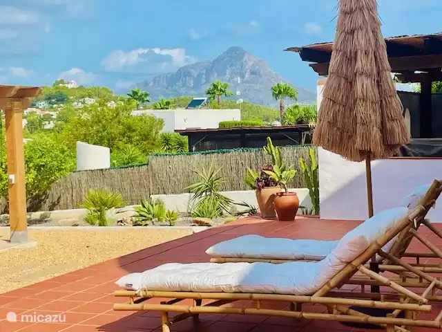 The large terrace has several seating areas.