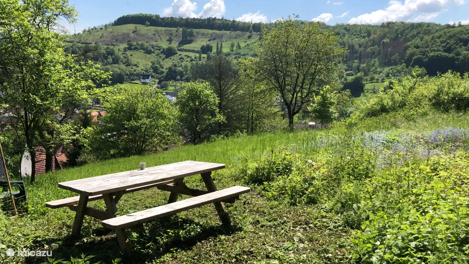 Picnic table located high in the garden with a view of the surrounding Weser Uplands