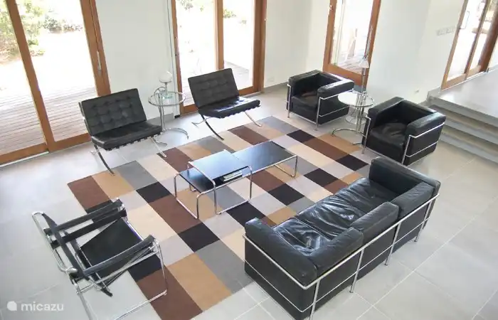 The furniture is designed by Le Corbusier, Mies van der Rohe and Mart Stam, Marcel Breuer, and Eileen Grey