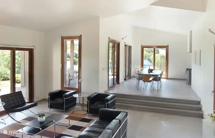 The living room and dining room are very spacious and have a high acoustic ceiling