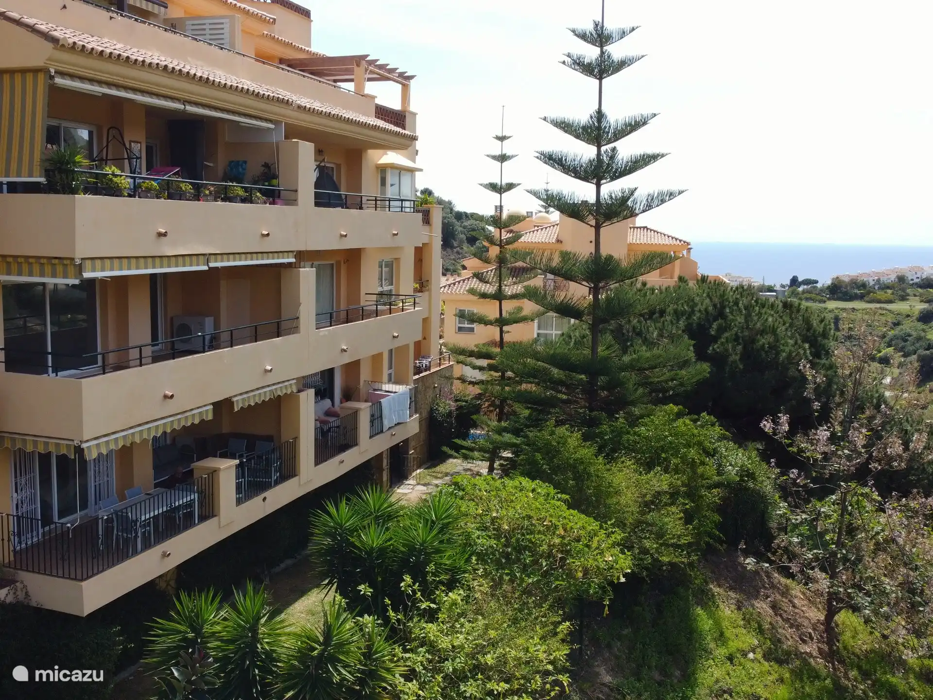 the apartment complex with its beautiful view over the hills and the sea