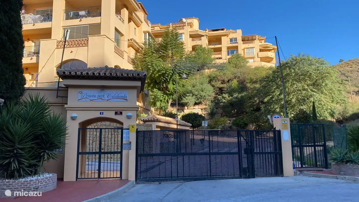 entrance of the complex (luxuriously fenced) with private garage and 3 swimming pools + sunbathing areas with free sunbeds