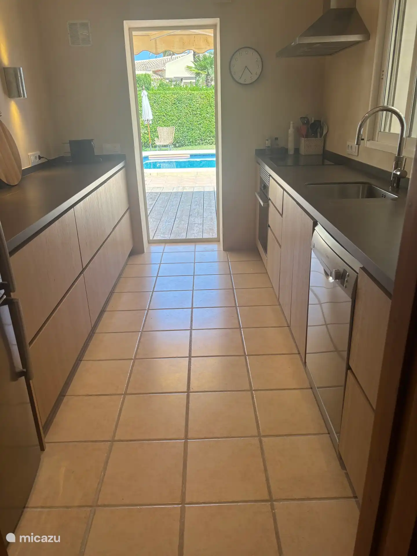 Kitchen with direct access to the terrace and pool