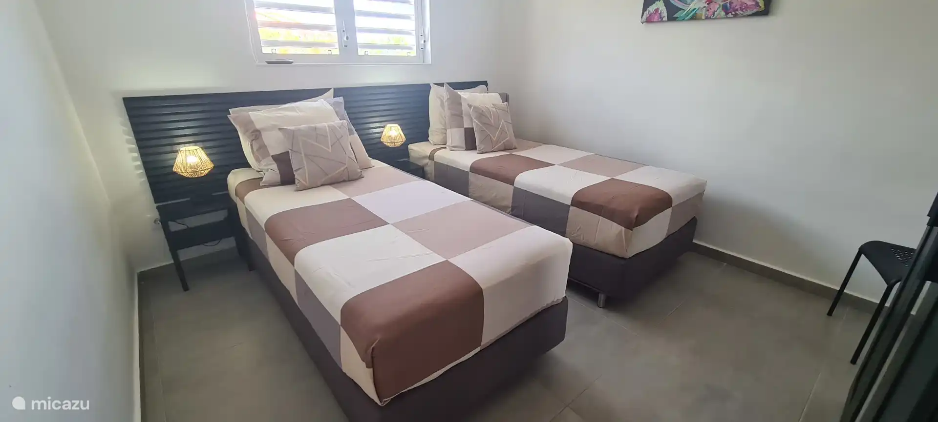 Both bedrooms have beds that can easily be pushed apart.