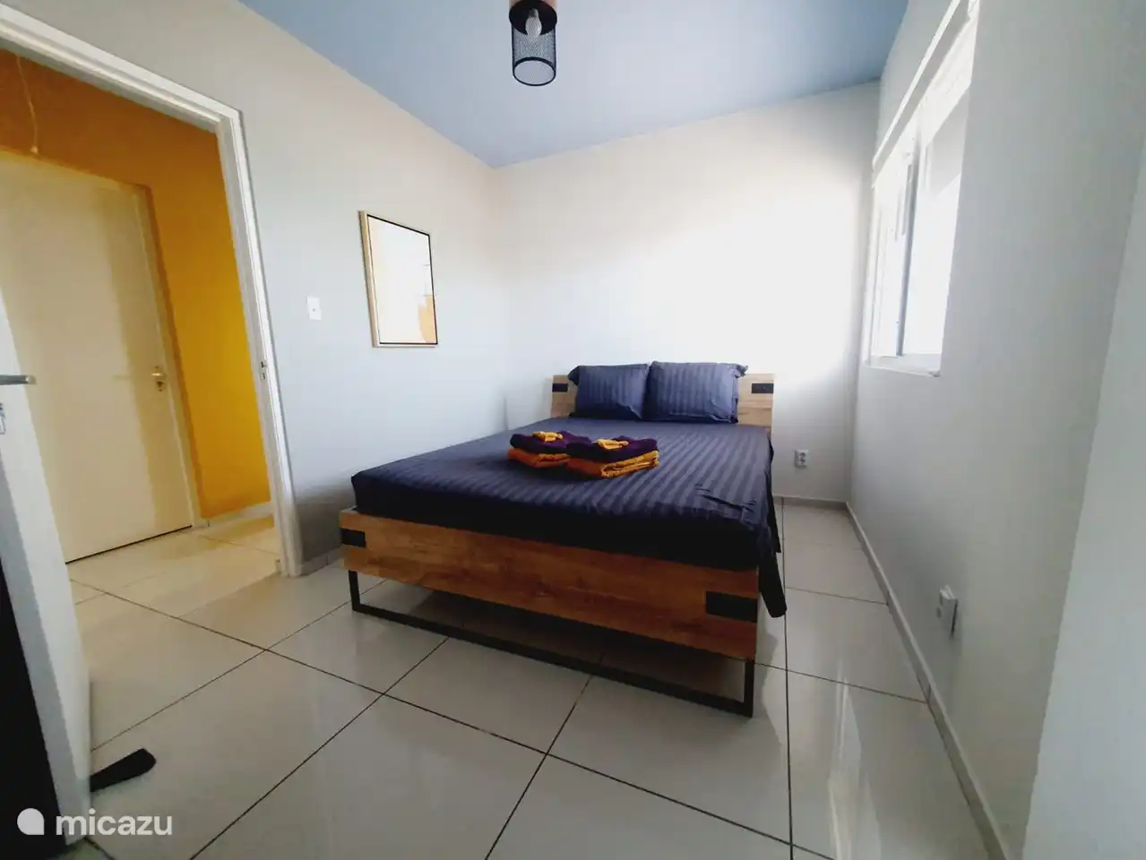 Bedroom 1 with double bed 160 cm wide and air conditioning and large wardrobe