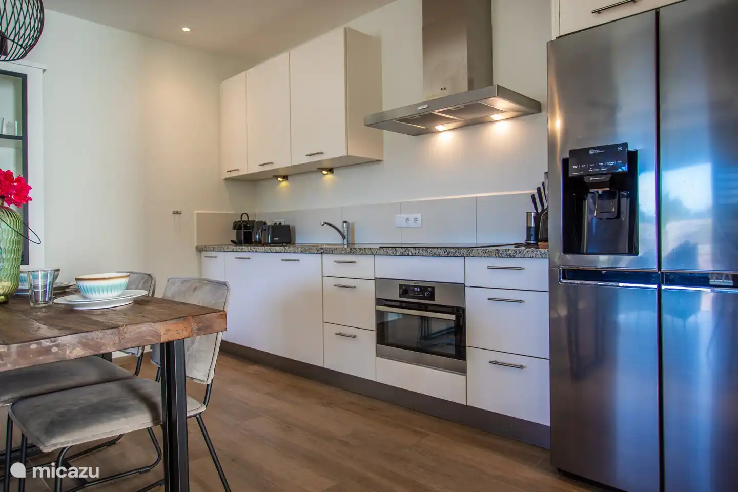 The open kitchen is fully equipped. 