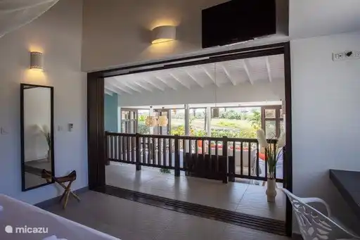 The master bedroom has spacious doors to the living room