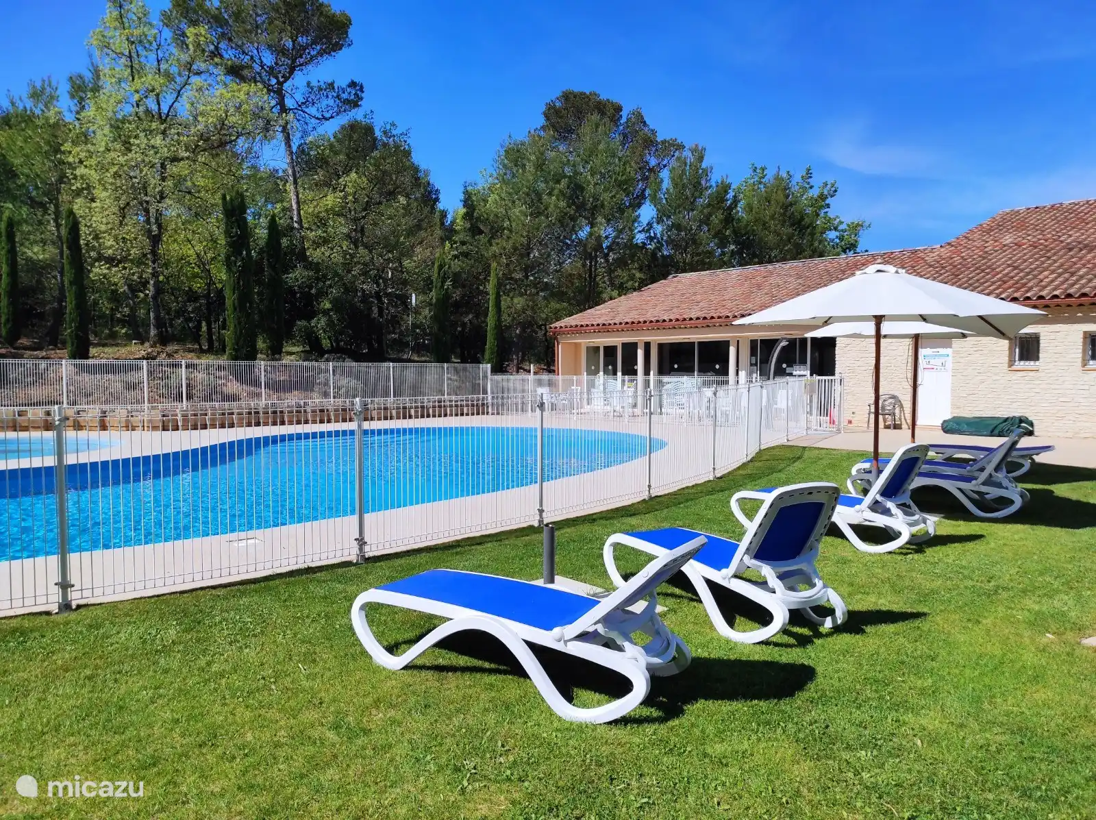 Large communal pool with sun loungers and more.
Next to it also a children&#39;s pool