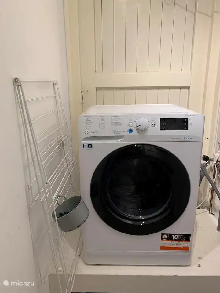 A washer/dryer, clothes rack with clothes pegs and ironing board with iron are at your disposal.