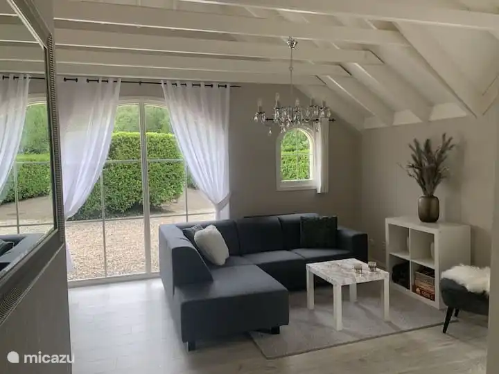 A nice spacious living room with authentic beamed ceiling.