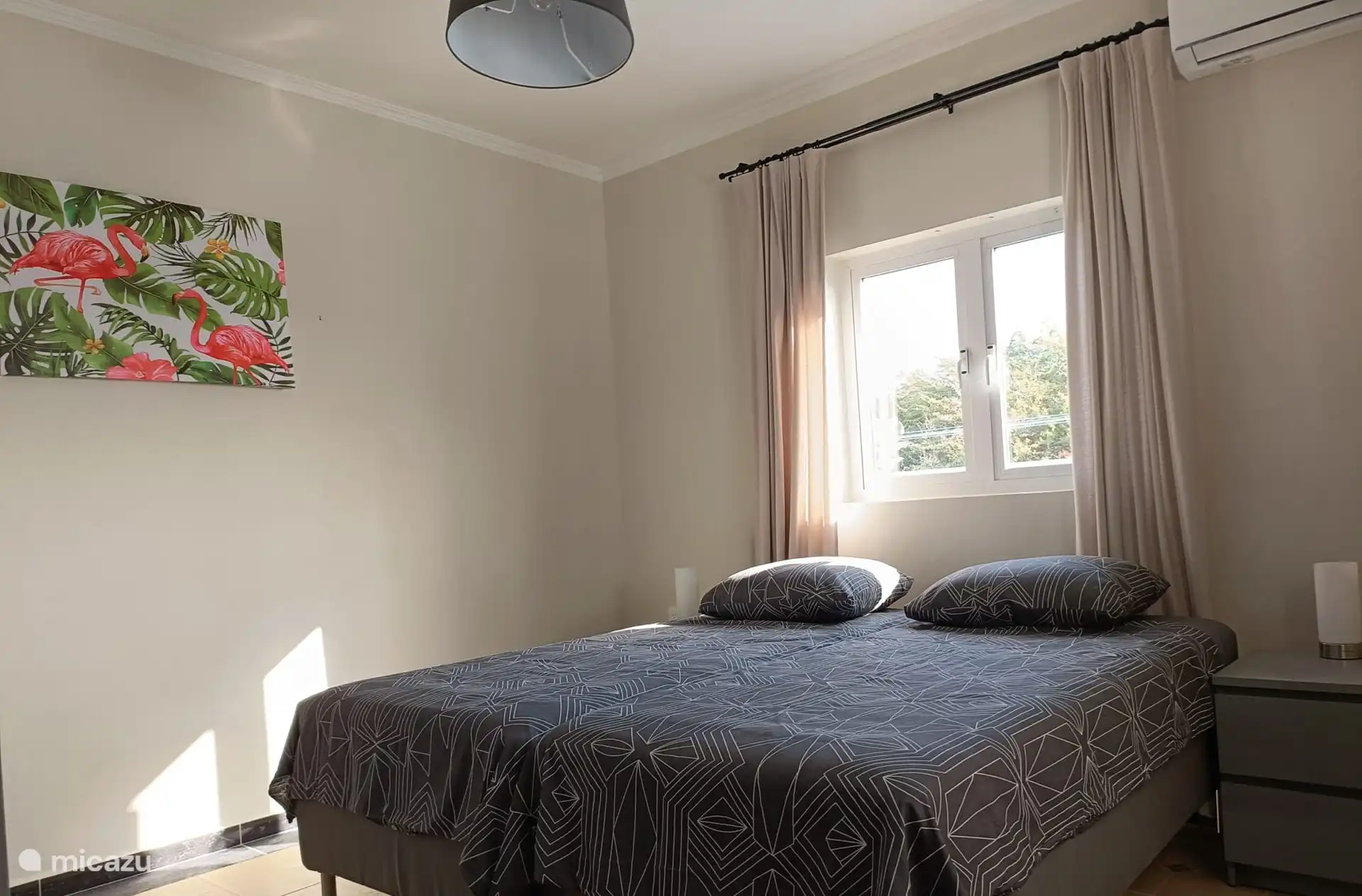 Bedroom 2, at the rear of the house, overlooking the Porch. Consisting of 2 box spring beds, bedside tables. In the bedroom there is a large, spacious hanging/cupboard.