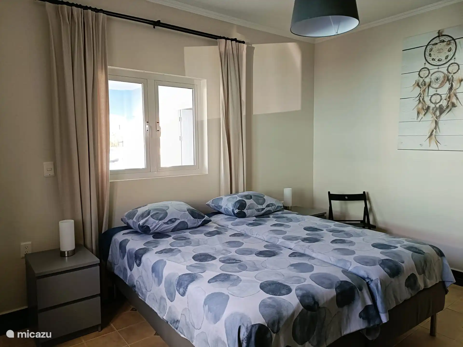 Bedroom 3, at the front of the house. Consisting of 2 box spring beds, bedside tables. In the bedroom there is a large, spacious hanging/cupboard.