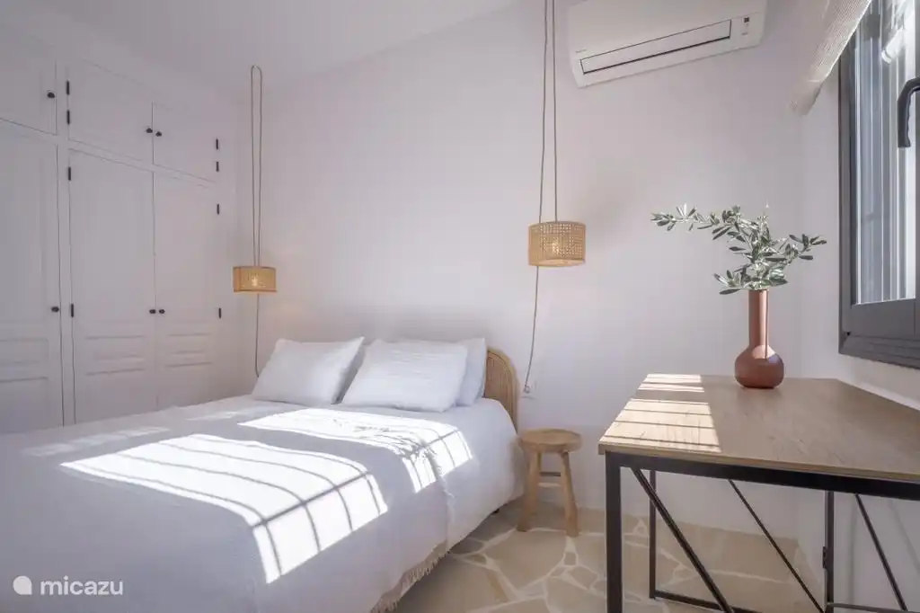 Room with bed 160 X 200 m. and a three-door cupboard, writing table.