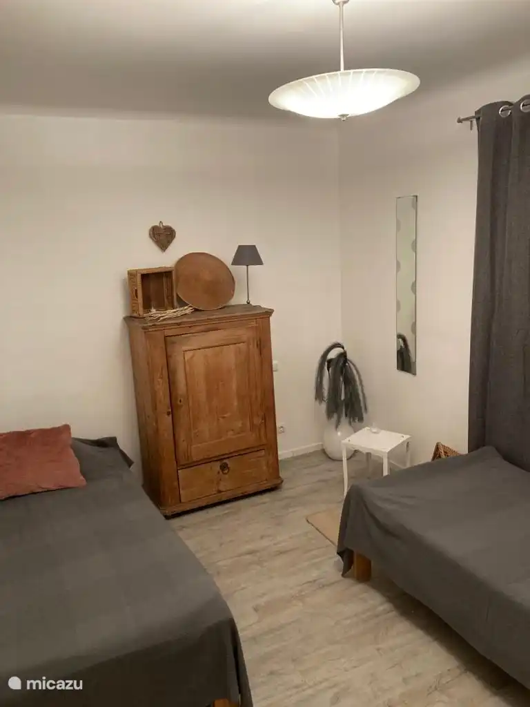 Bedroom, 2x 1 bed. Adjacent living room and private bathroom