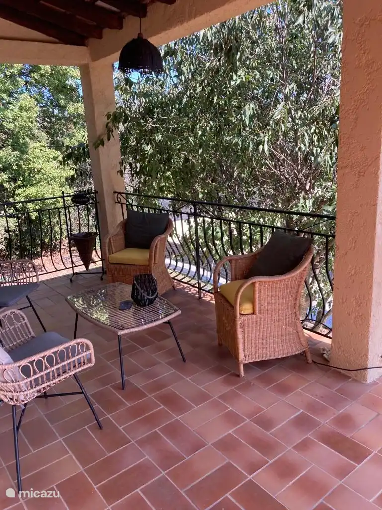 sitting area terrace 1st floor adjacent kitchen and living room overlooking the pool