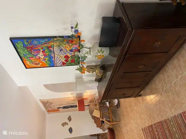 Sideboard containing placemats, candles, tablecloths, etc.