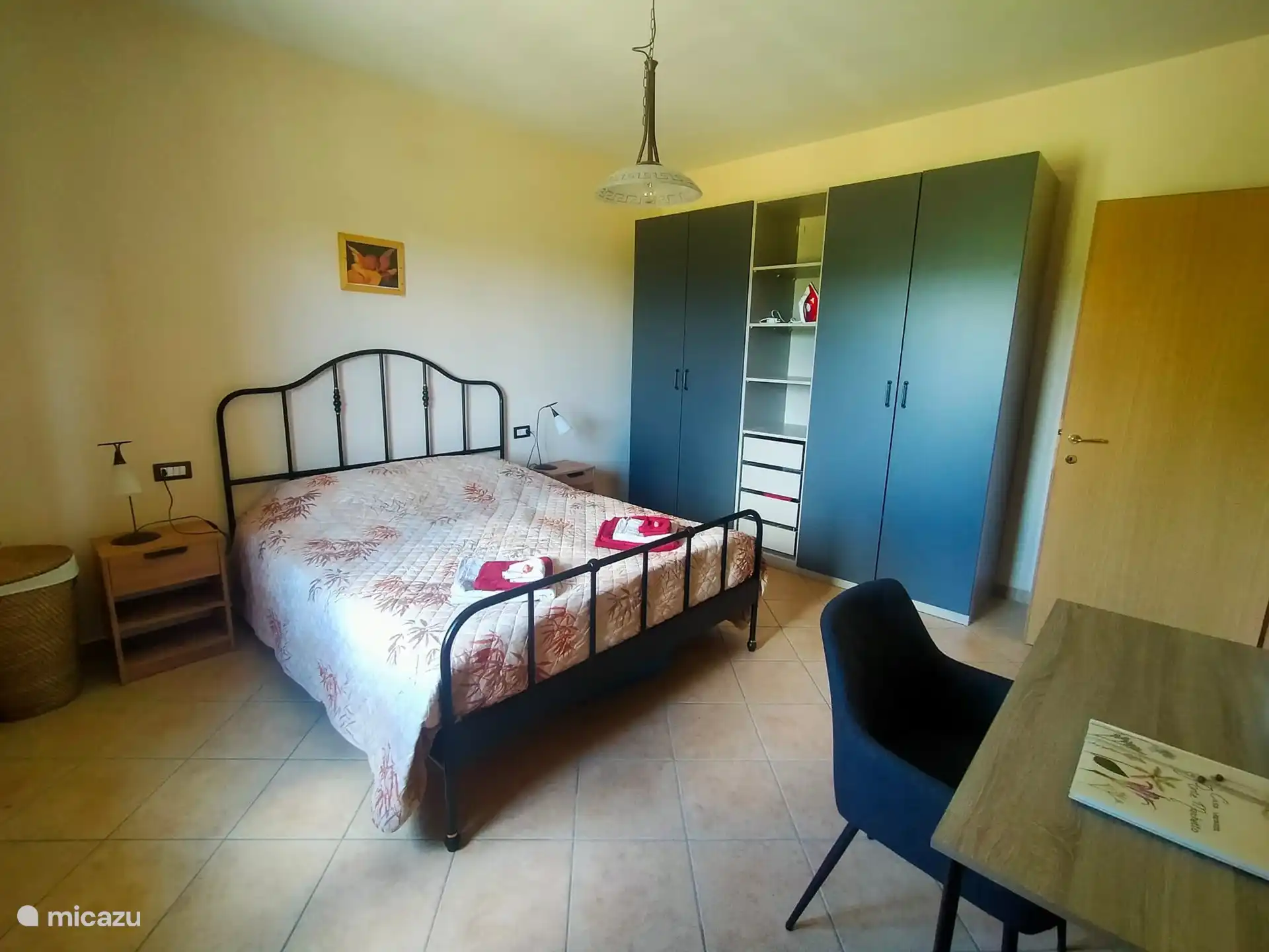 The bedroom with spacious storage cupboards.