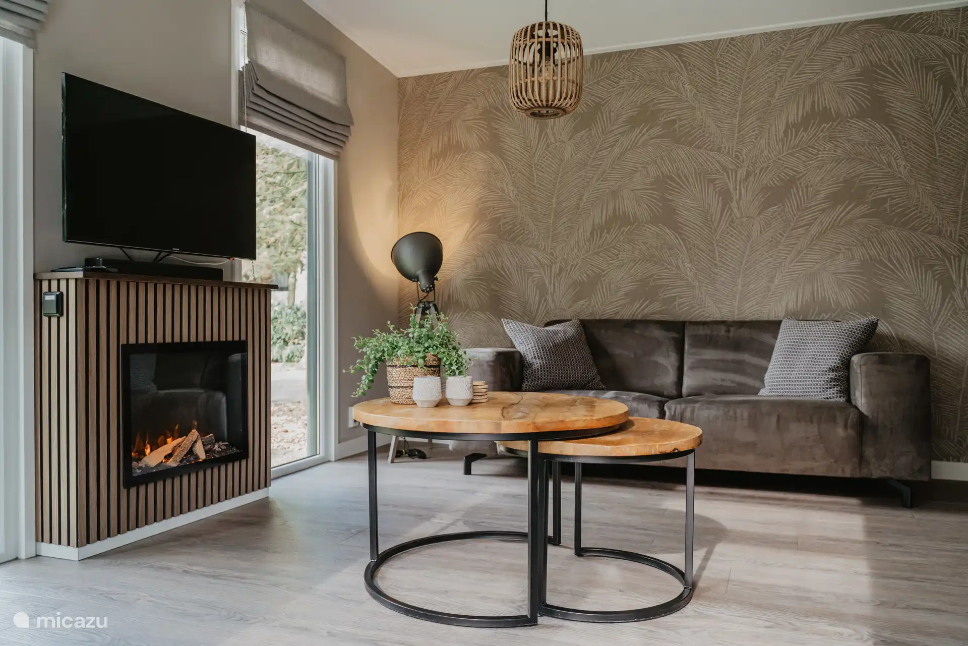 Living room with cozy fireplace and Smart TV including Netflix.