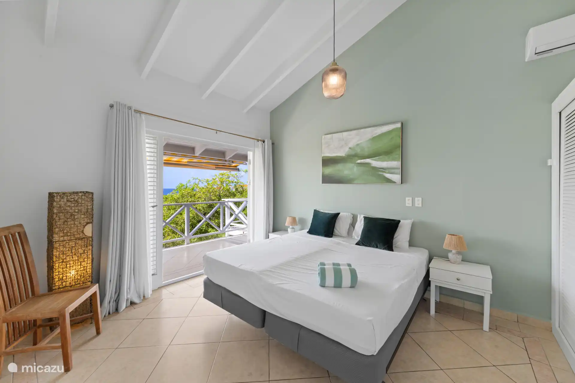 Master bedroom has access to balcony.