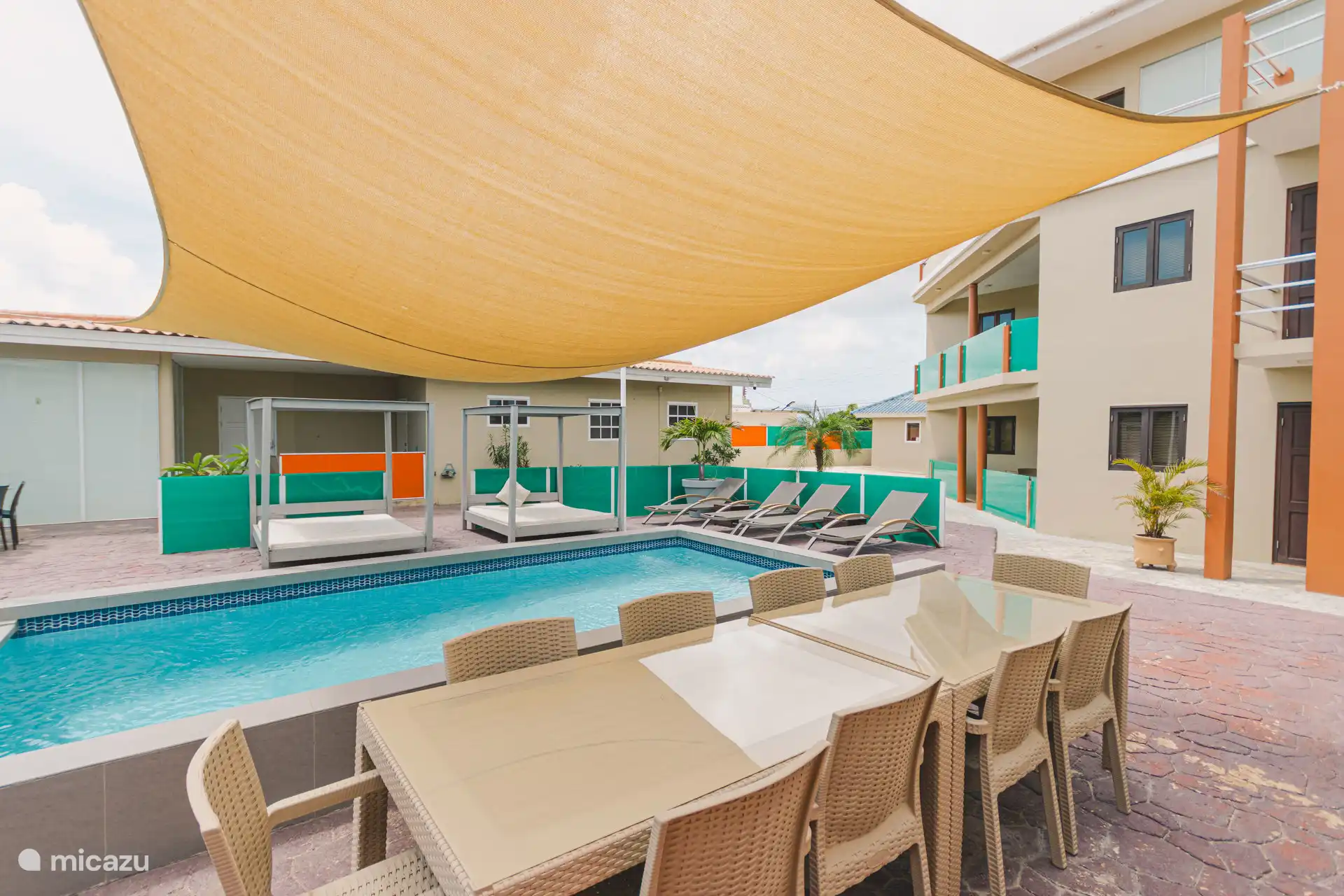 beach chairs and seating and tables are available at the pool