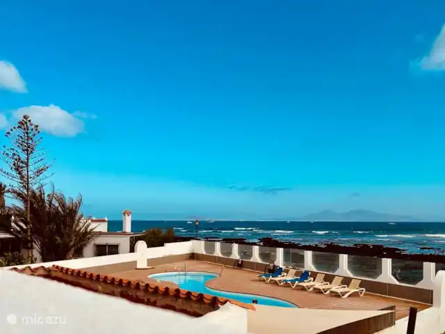 The Beach House (nouvelle inscription) | Espagne, Fuerteventura, Corralejo - maison de vacances La maison est située dans une station balnéaire à petite échelle avec seulement 28 maisons et une grande piscine commune qui est généralement très calme et magnifiquement située au bord de la mer