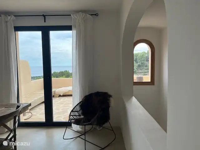 dining room opening onto spacious lounge/terrace with breathtaking views