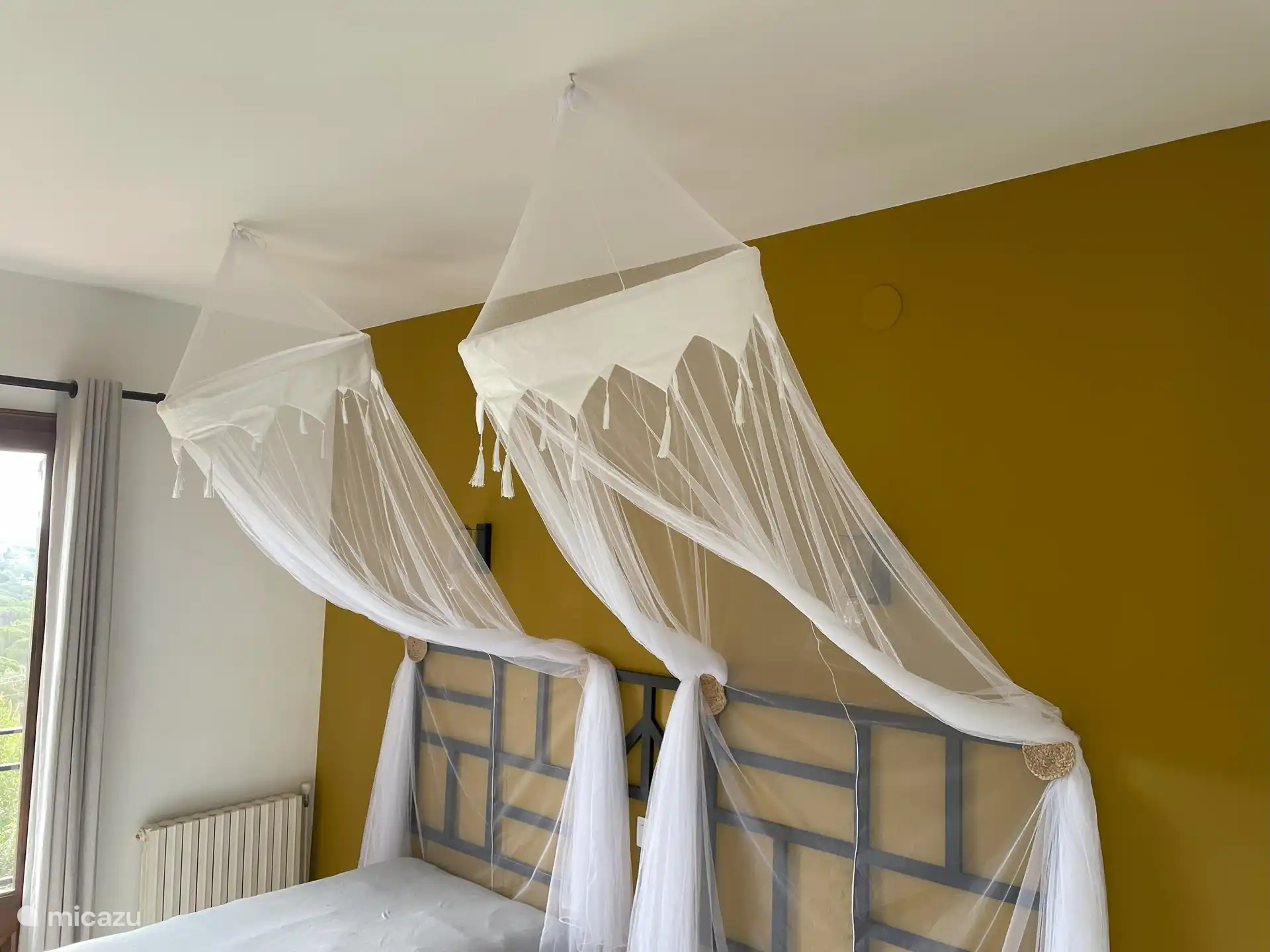 Bedroom with single beds and balcony