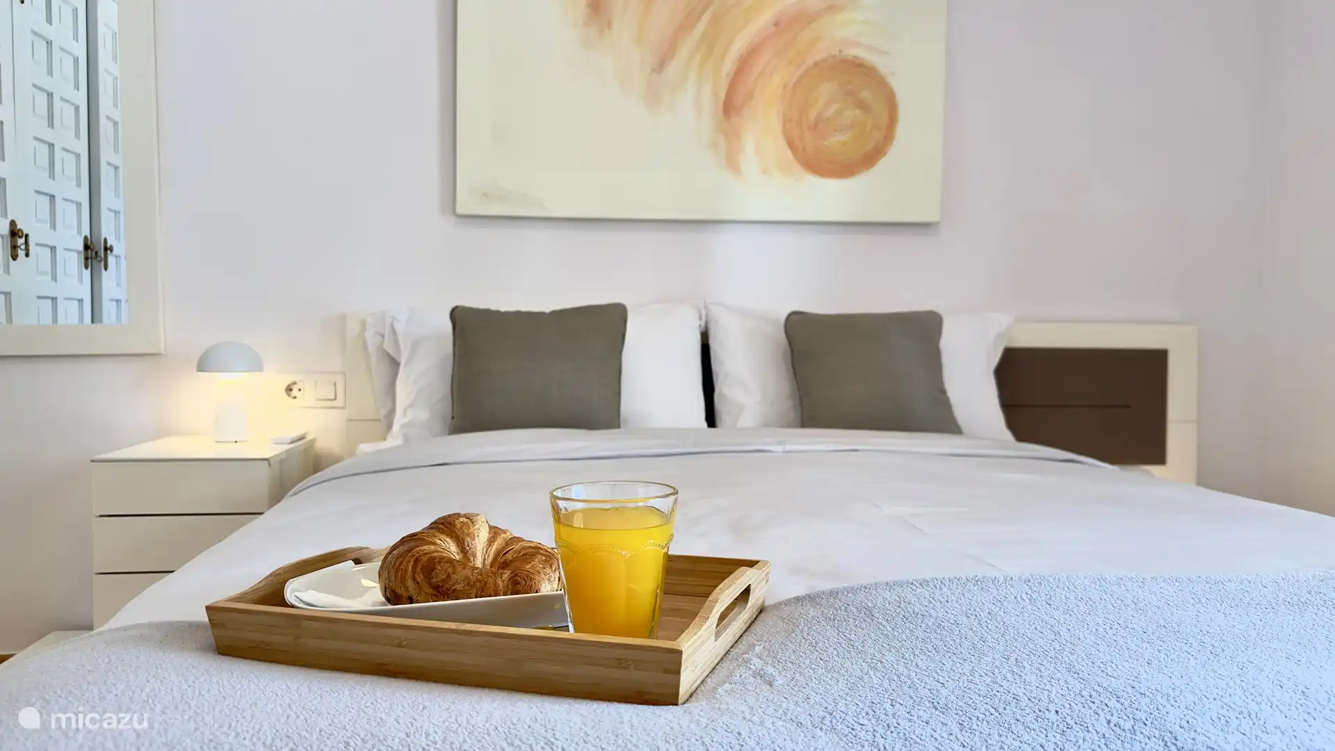 Bedroom with ceiling fan and heating, plenty of storage space