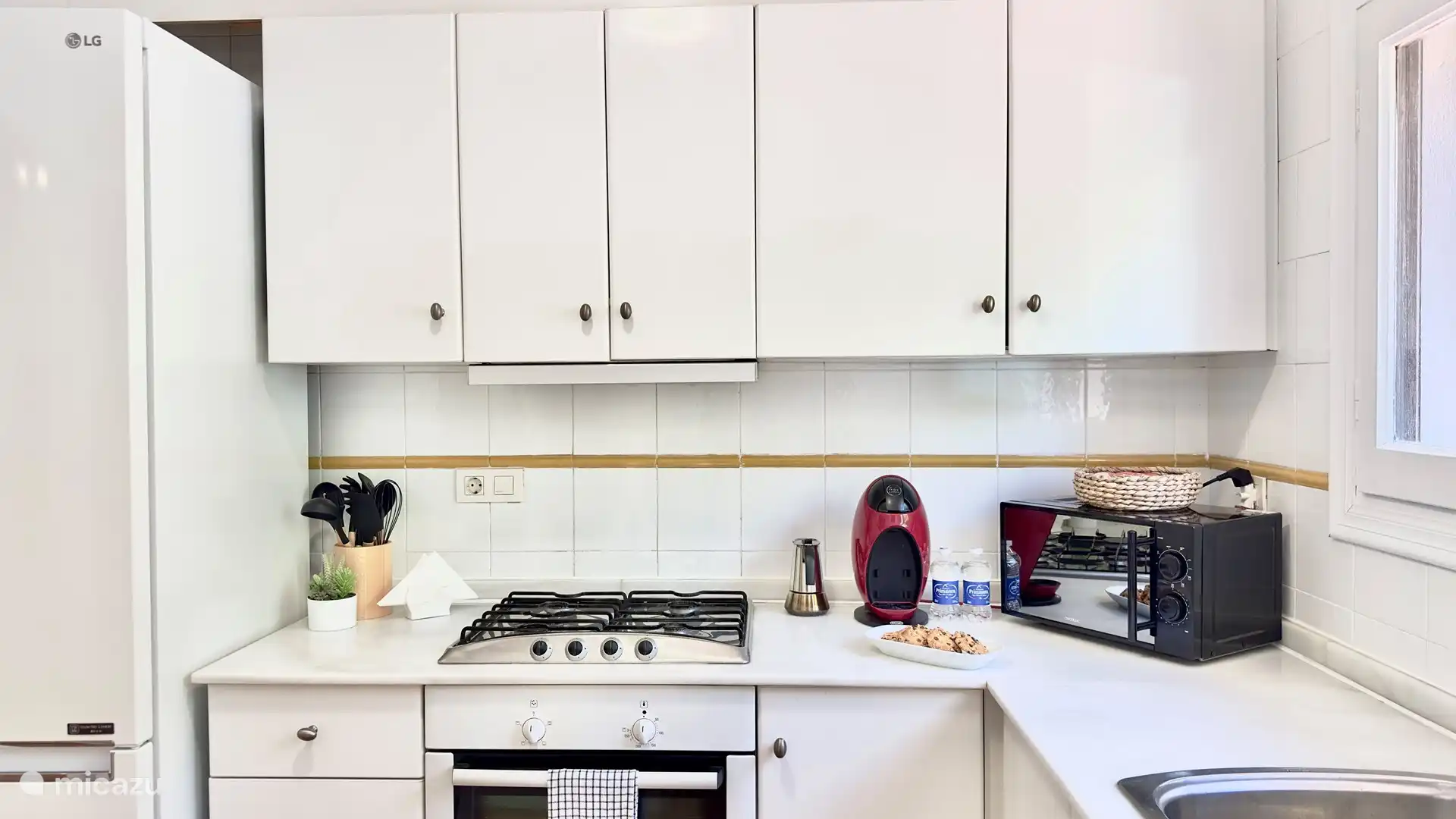 Kitchen with oven, microwave, dishwasher, refrigerator and refrigerator,...