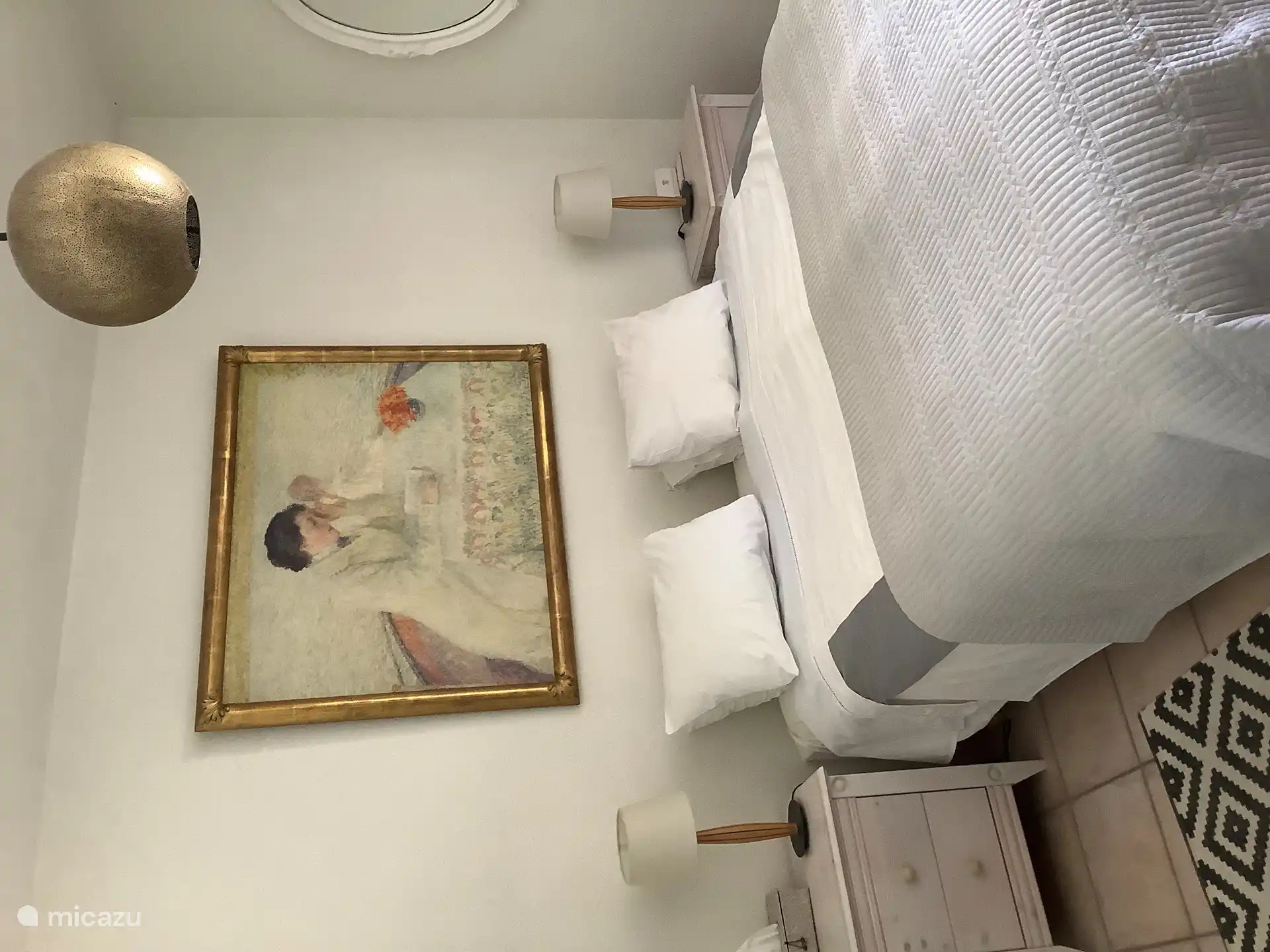 De hoofdslaapkamer op de tuinverdieping