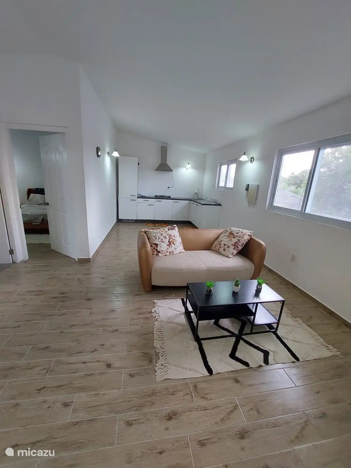 This gives you a beautiful view of the kitchen, which is fully equipped. Built-in fridge freezer, 4 burner gas hob. dishwasher. microwave