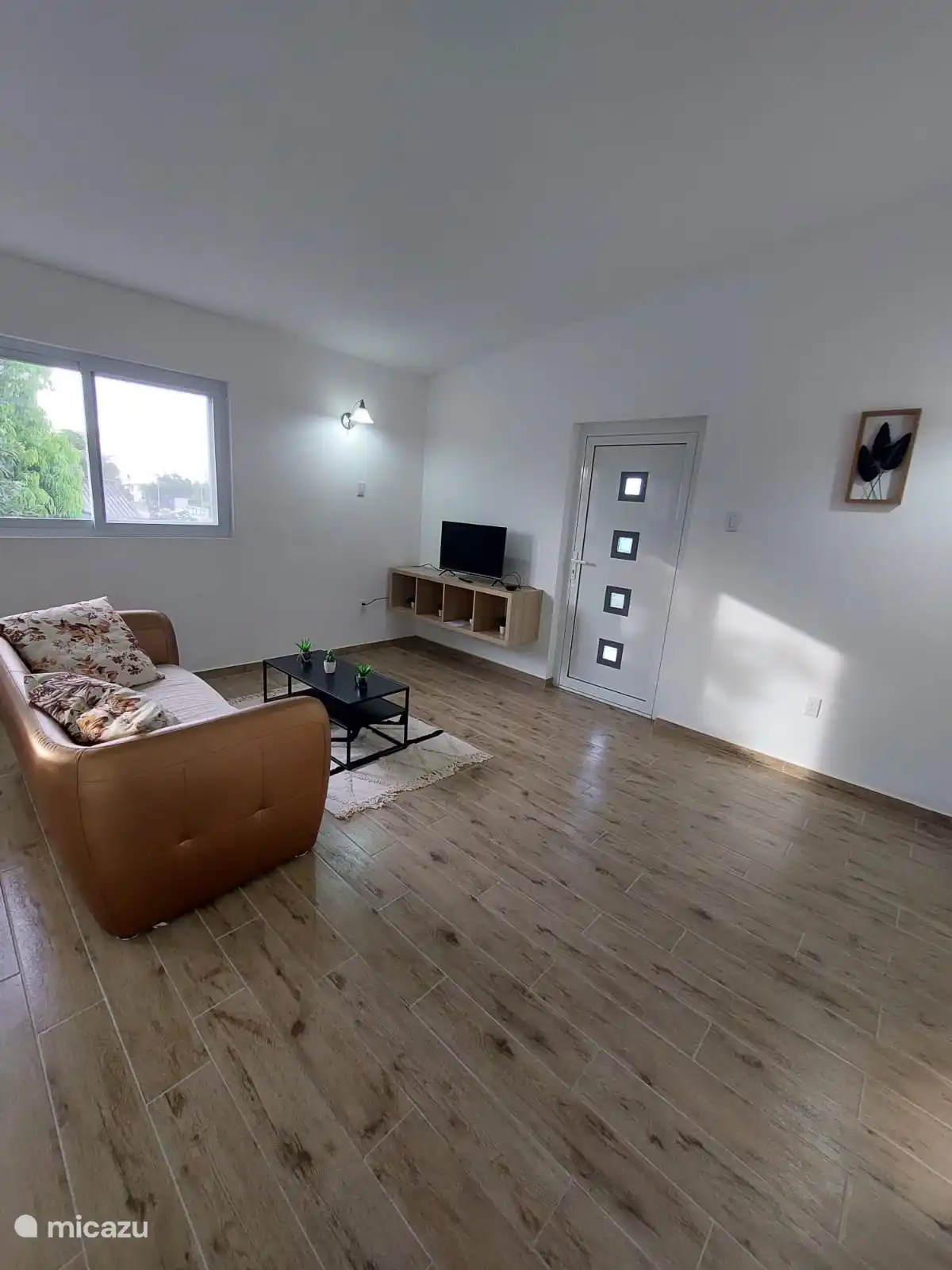 View to the front door. As you can see, everything is sleek and freshly decorated