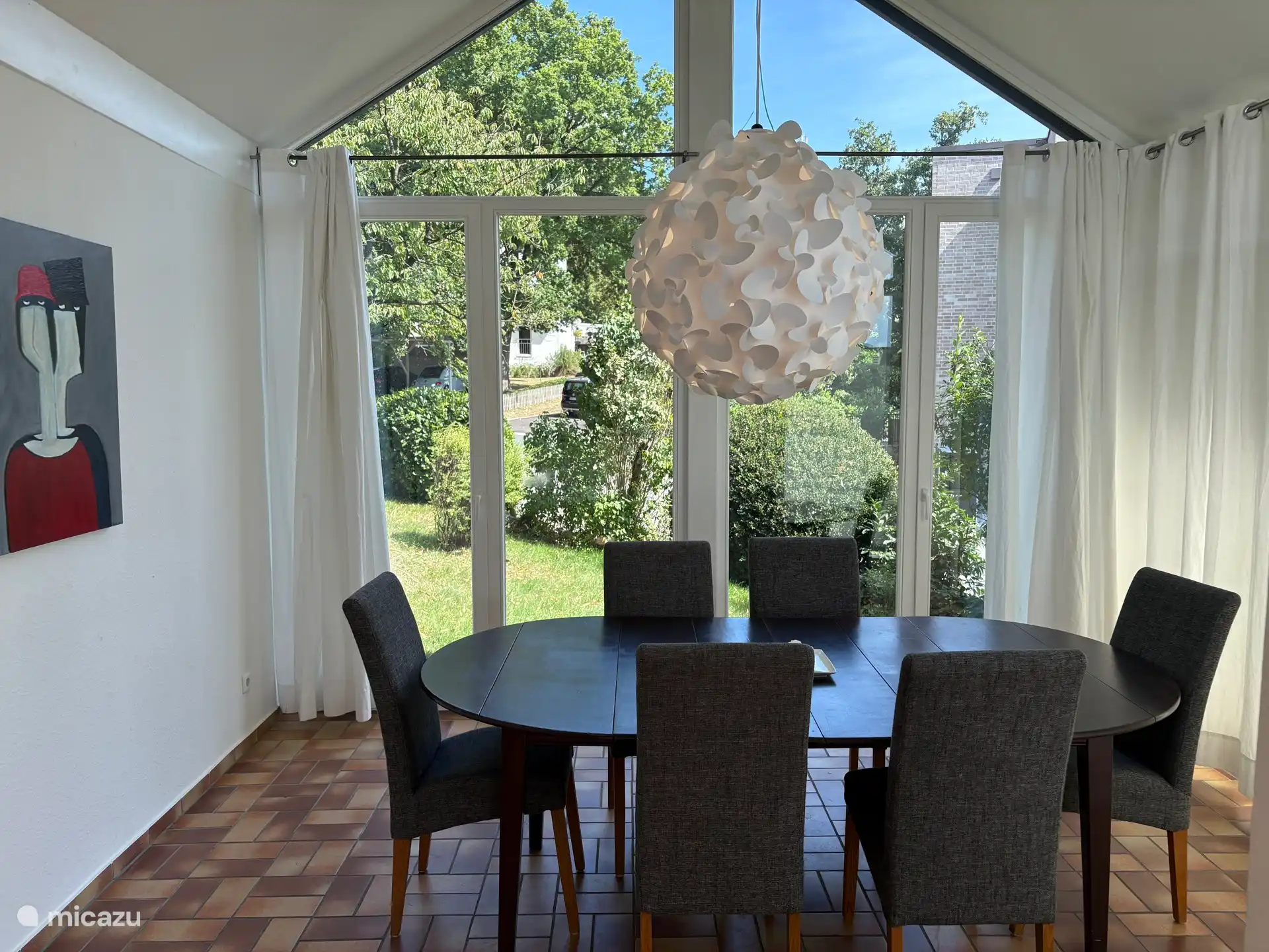 spacious conservatory with large dining table