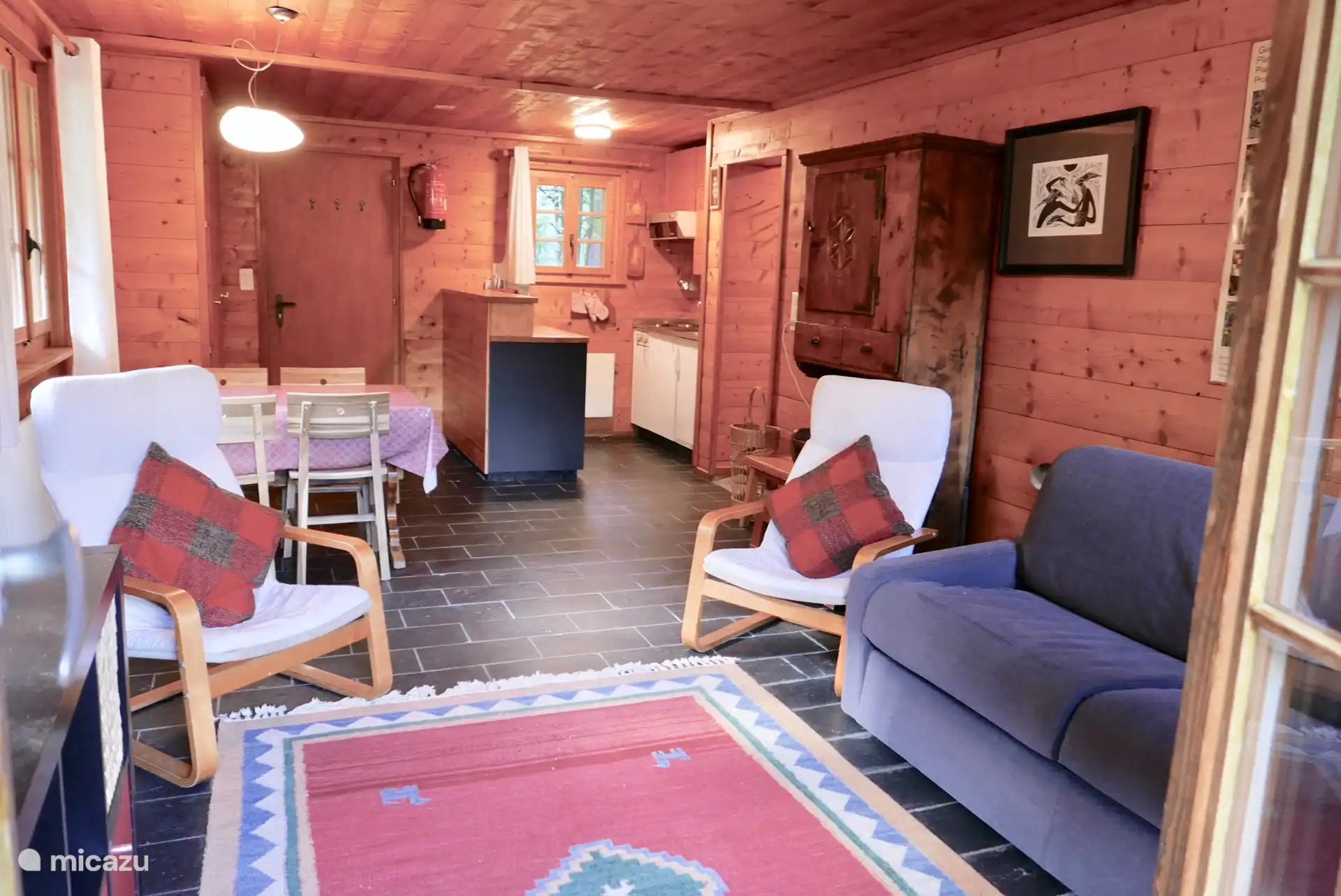 Studio living room with pull-out bed opening onto the terrace