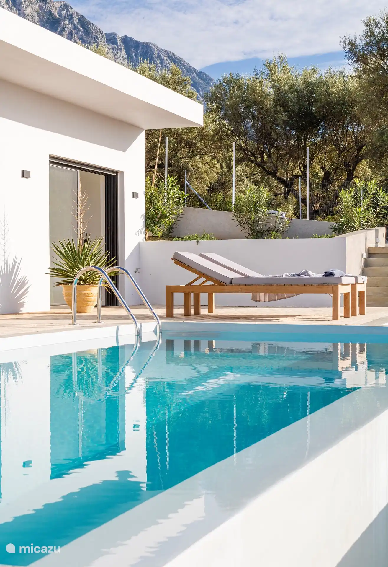 Pool view and sunbeds