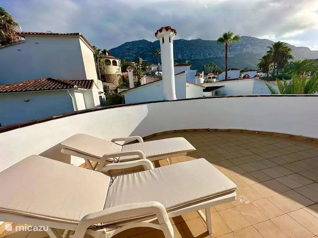 Balcony in the sun, with 2 sun loungers, view of the Montgó.