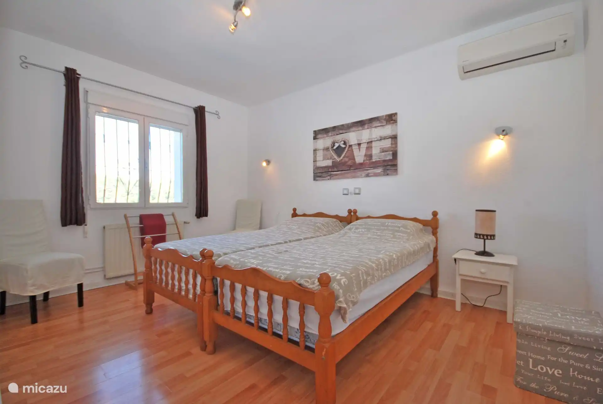 double bedroom upstairs with air conditioning